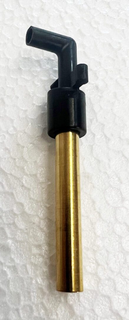 A black and gold pen on top of white paper.