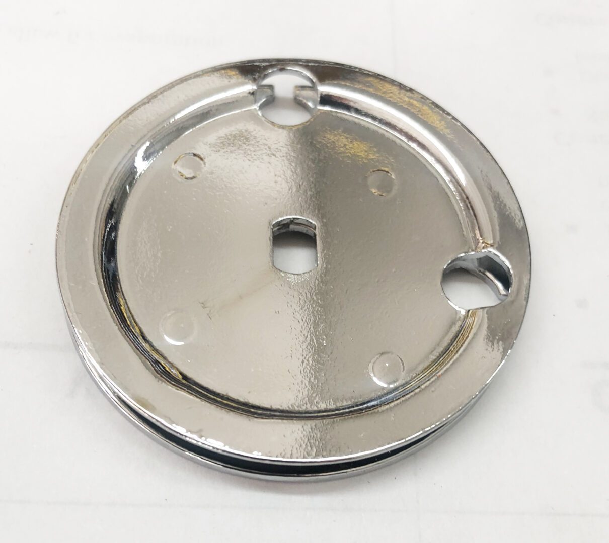 A metal plate with holes for the top of it.