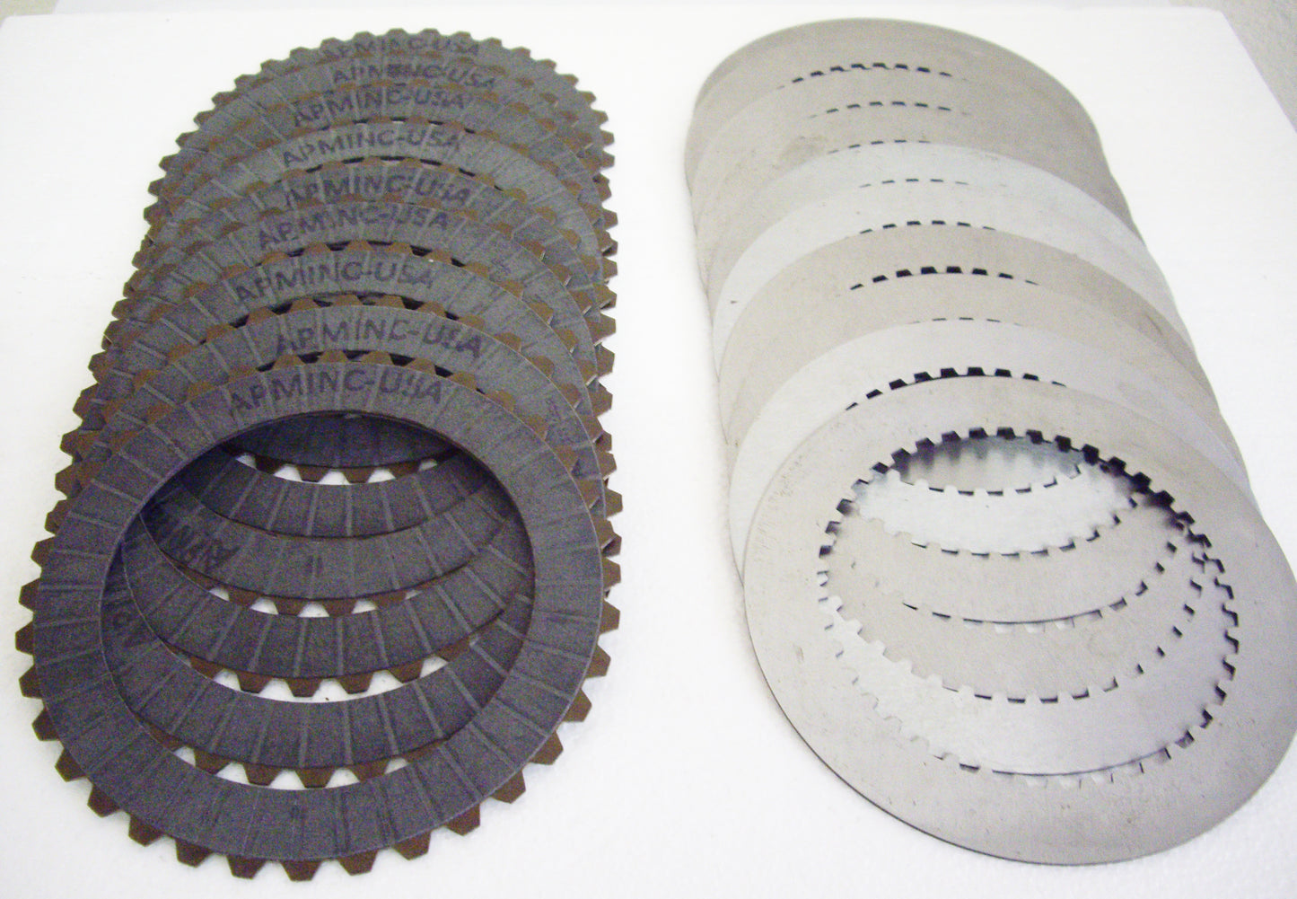 A group of different types of clutches and plates.