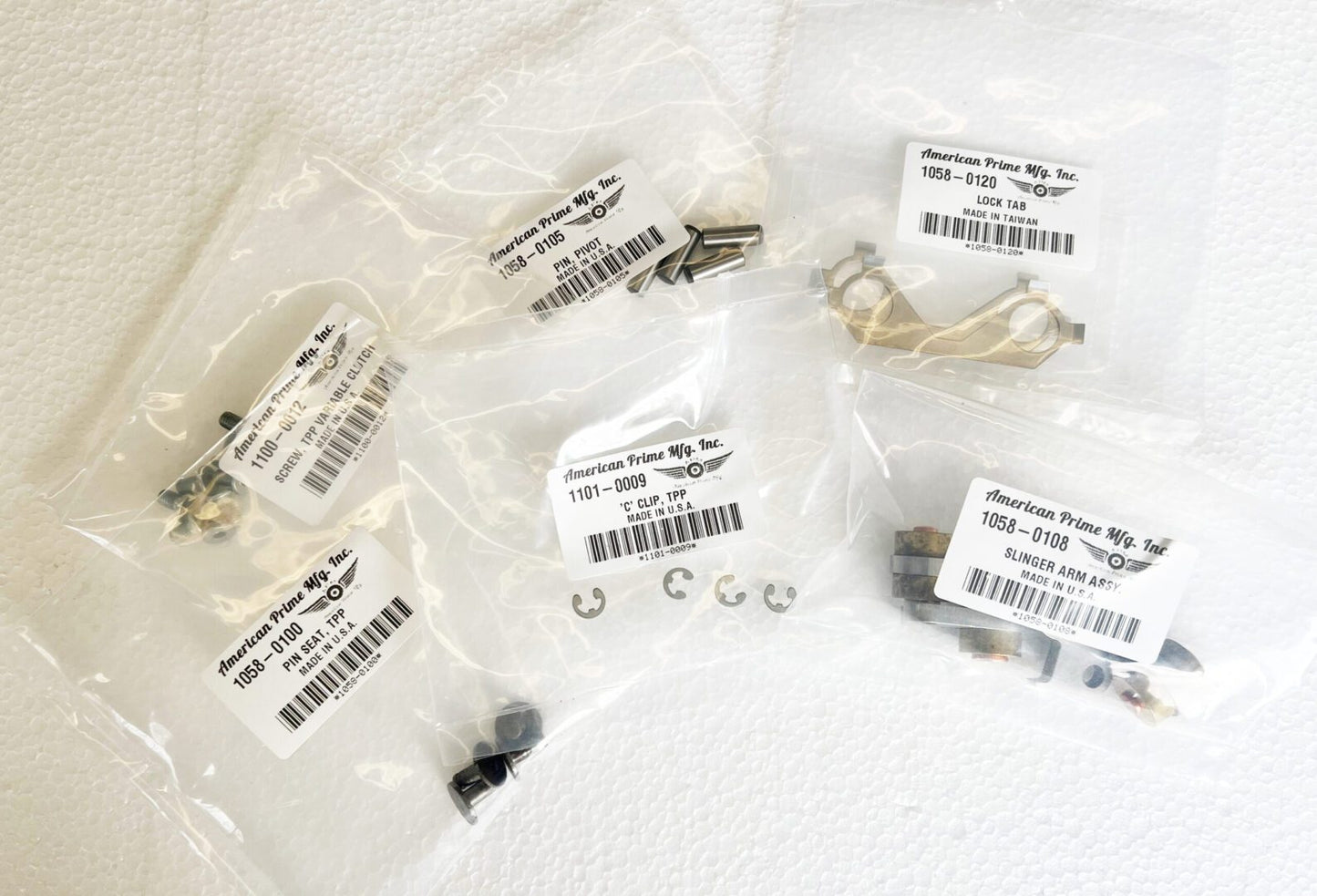 A bunch of different types of parts in plastic bags.