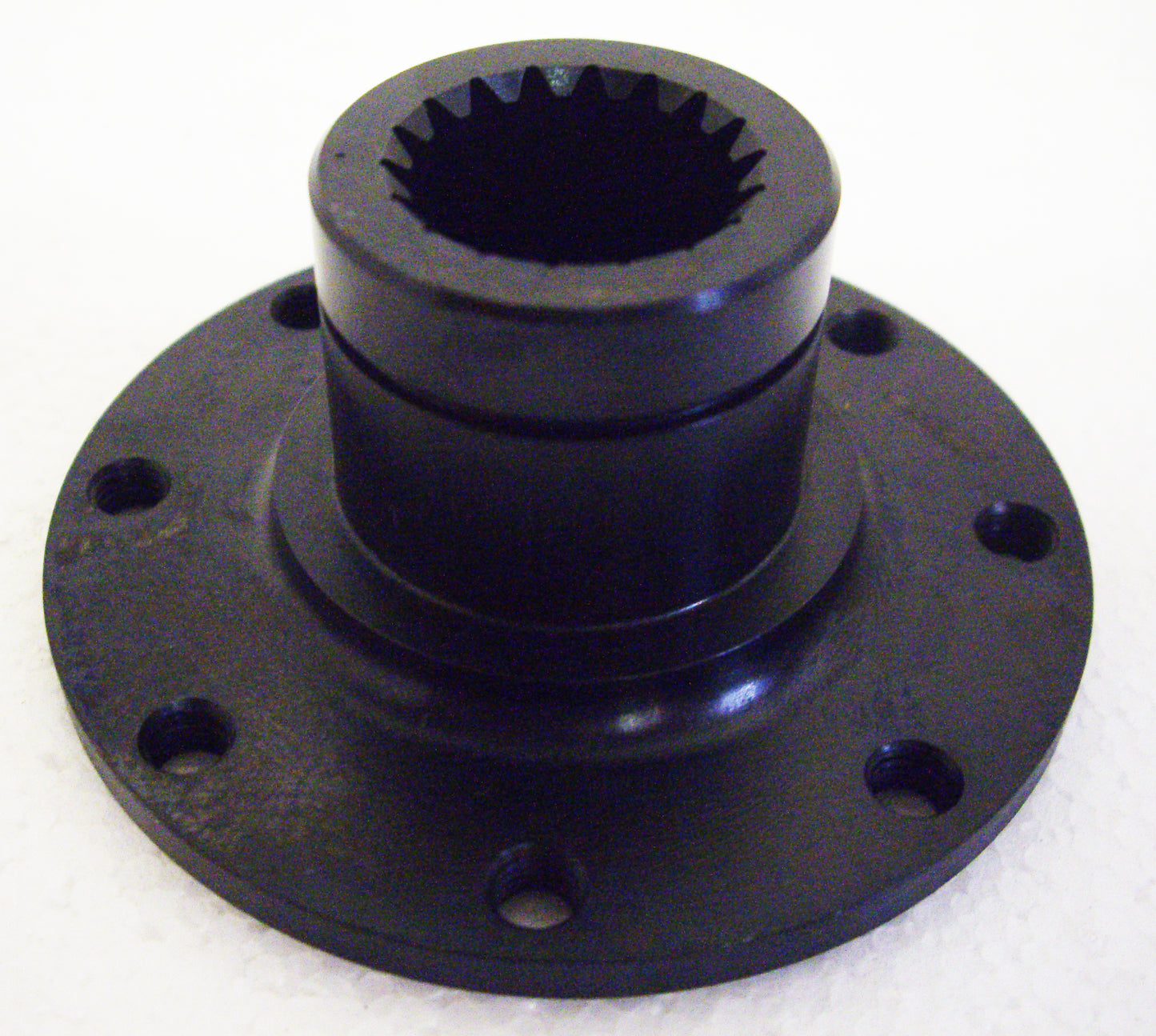 A black plastic disc with a hole in the center.