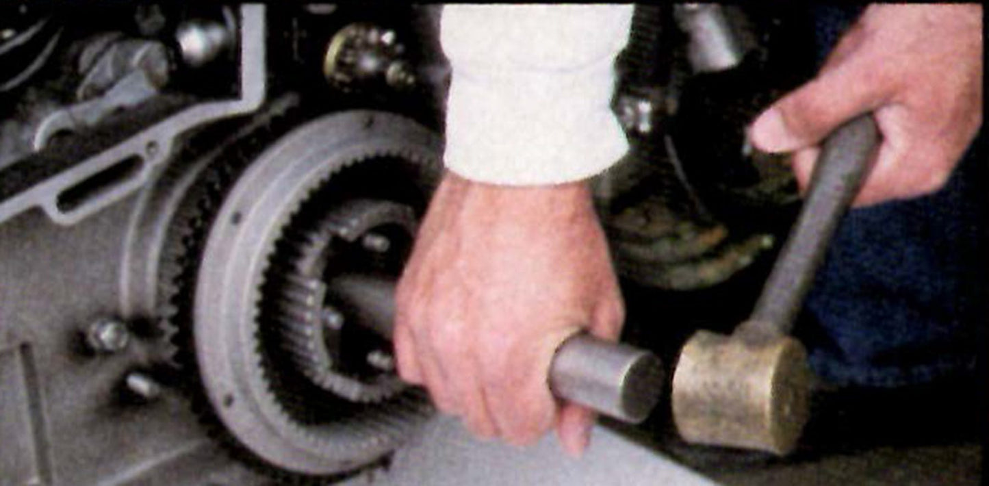 A person holding a wrench in their hand.