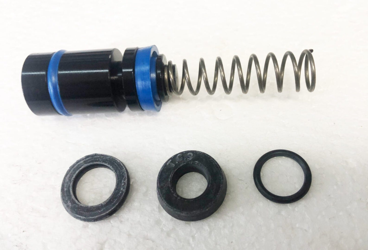 A close up of the springs and seals on a water pump