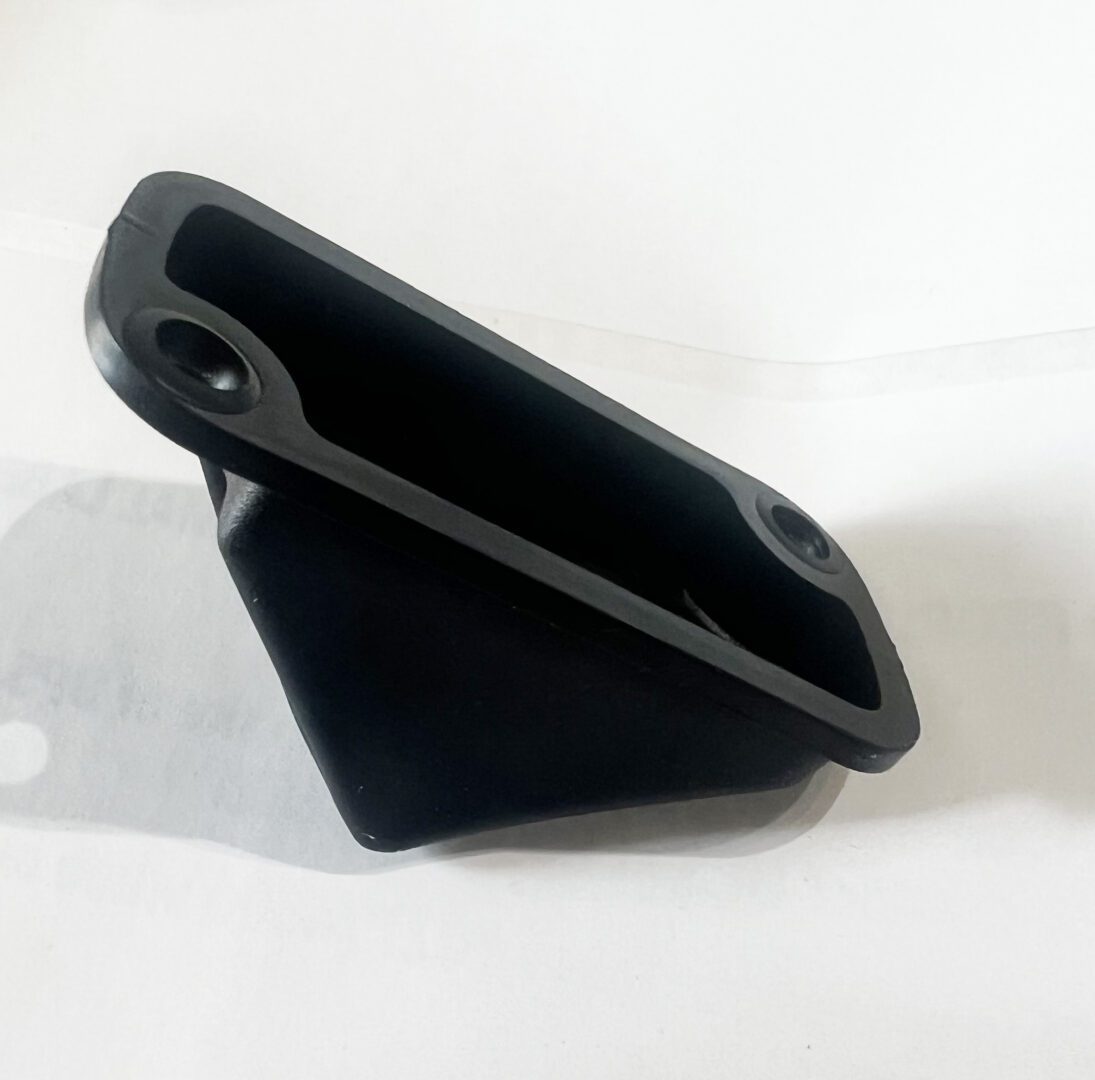 A black phone case sitting on top of a table.