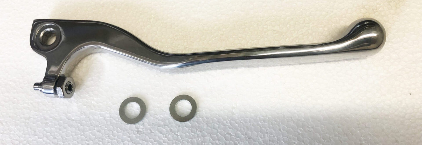 A metal handle and some washers on top of a white surface.