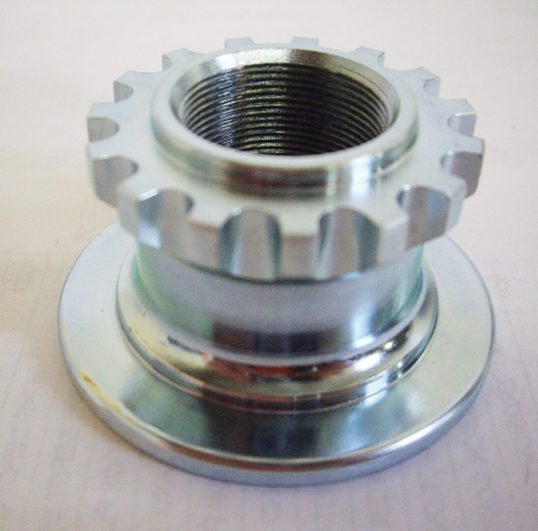 A close up of an aluminum bicycle hub