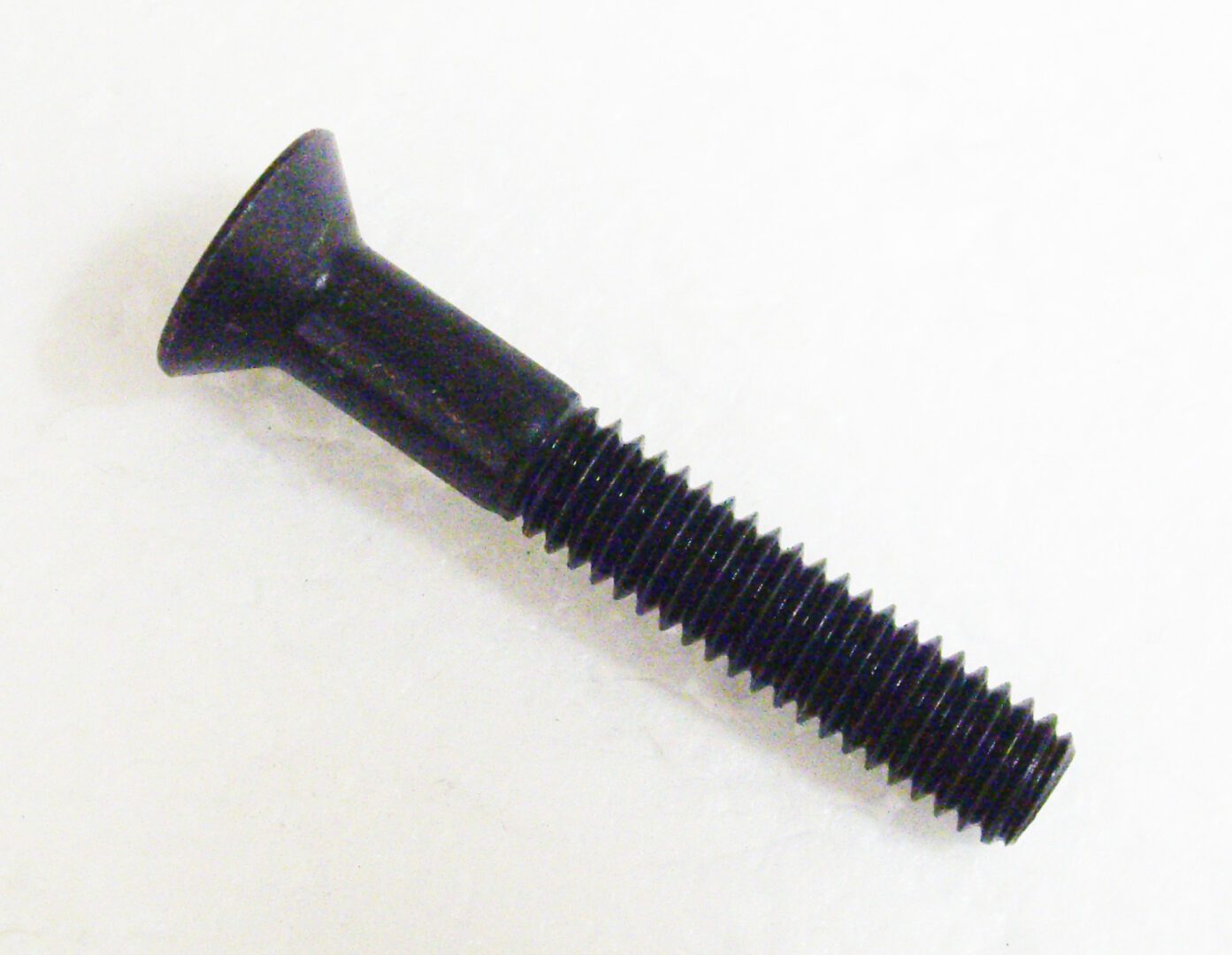 A black screw with a long handle on top of it.