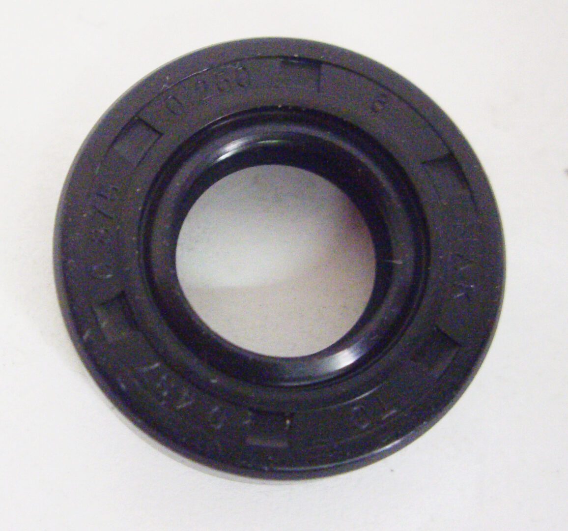 A black rubber seal ring sitting on top of a table.