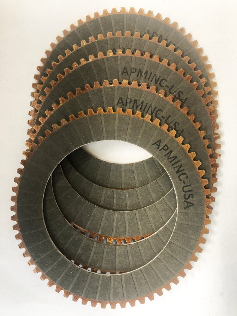 A group of four plates that are stacked on top of each other.