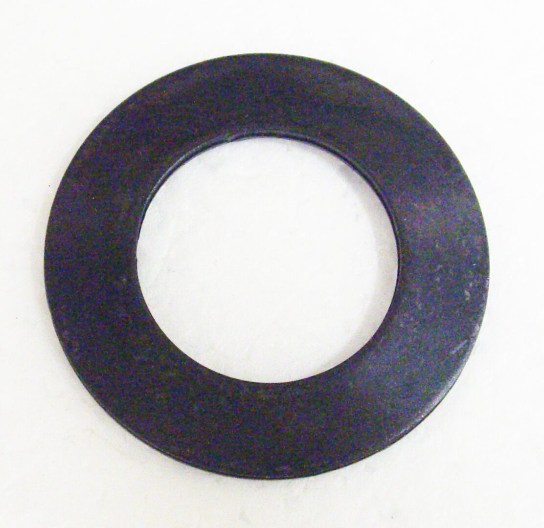 A black washer is sitting on the floor.