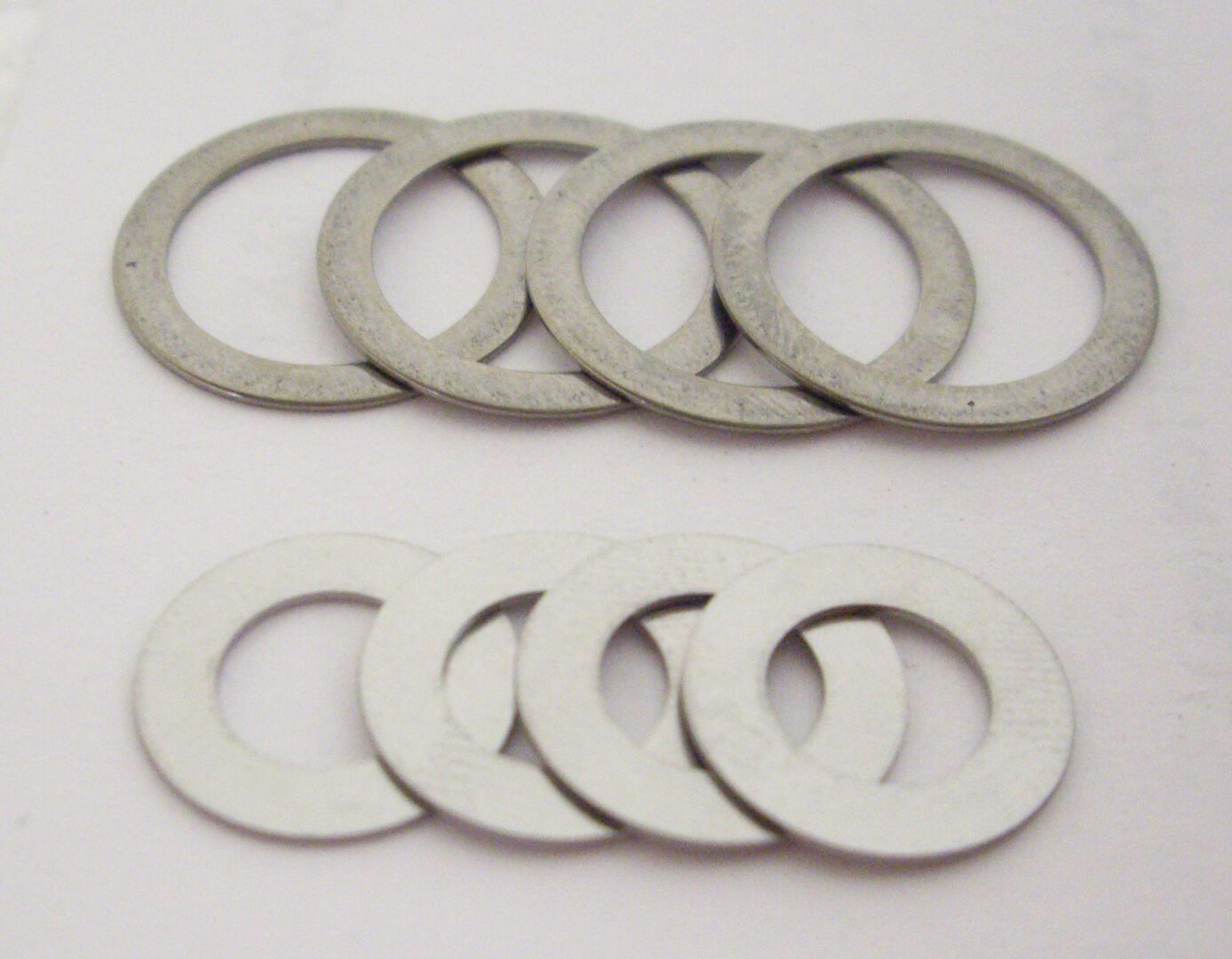 A set of eight washers and one washer is cut out.