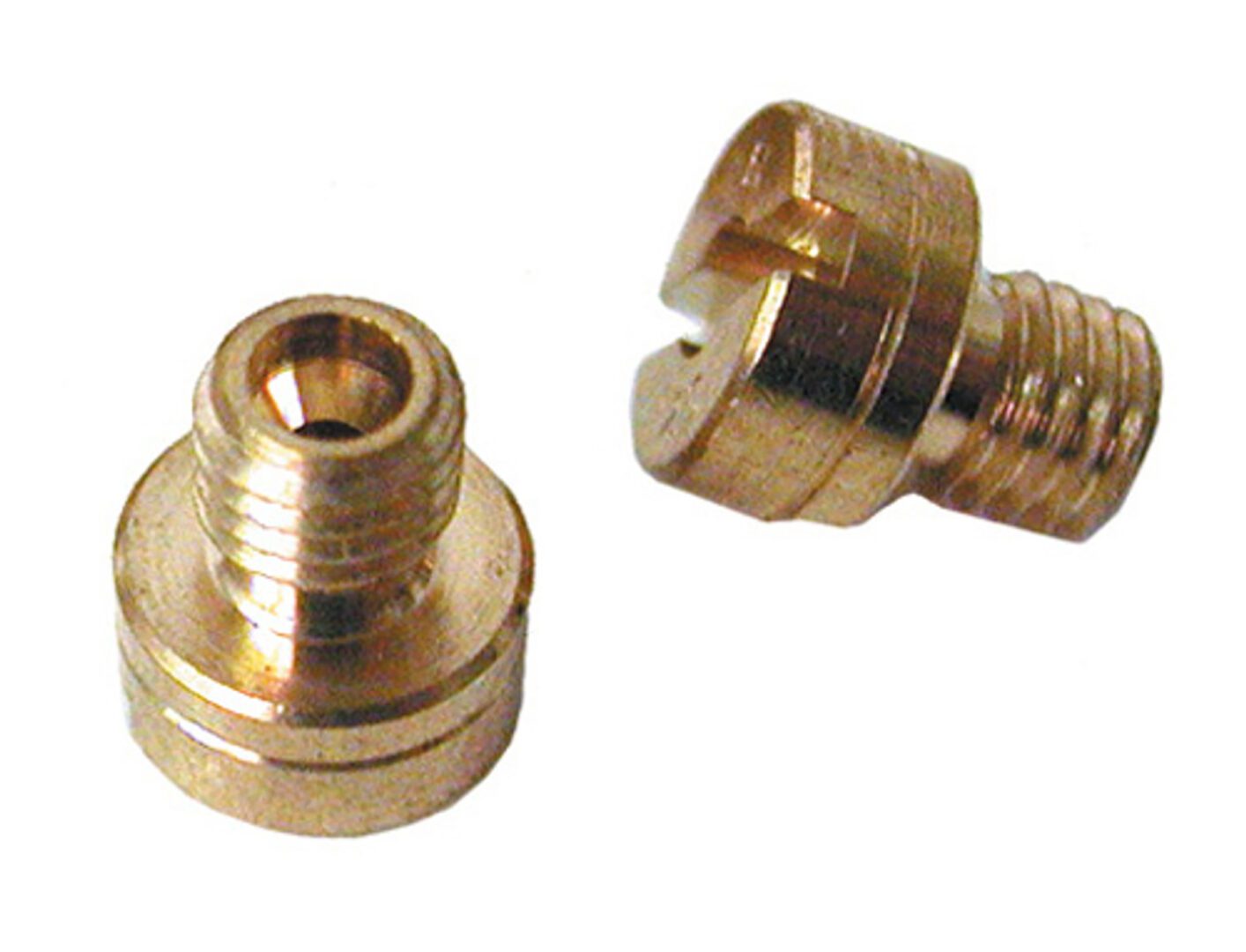 A pair of brass nuts and bolts are sitting on top of each other.