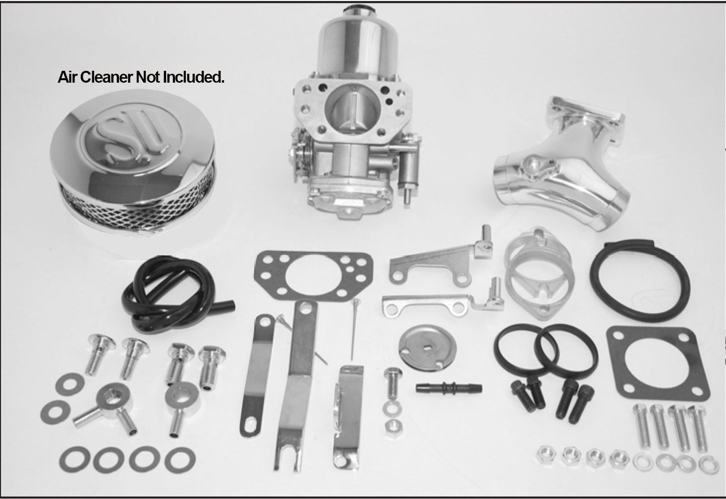 A white table with many parts and tools on it