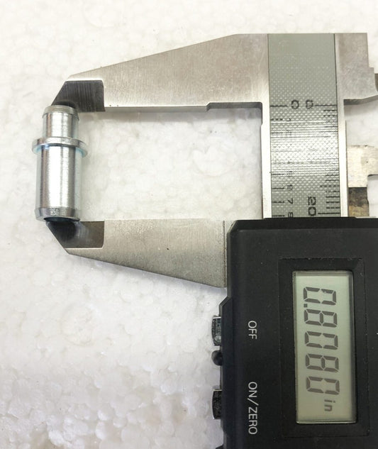 A digital caliper is shown next to a metal object.
