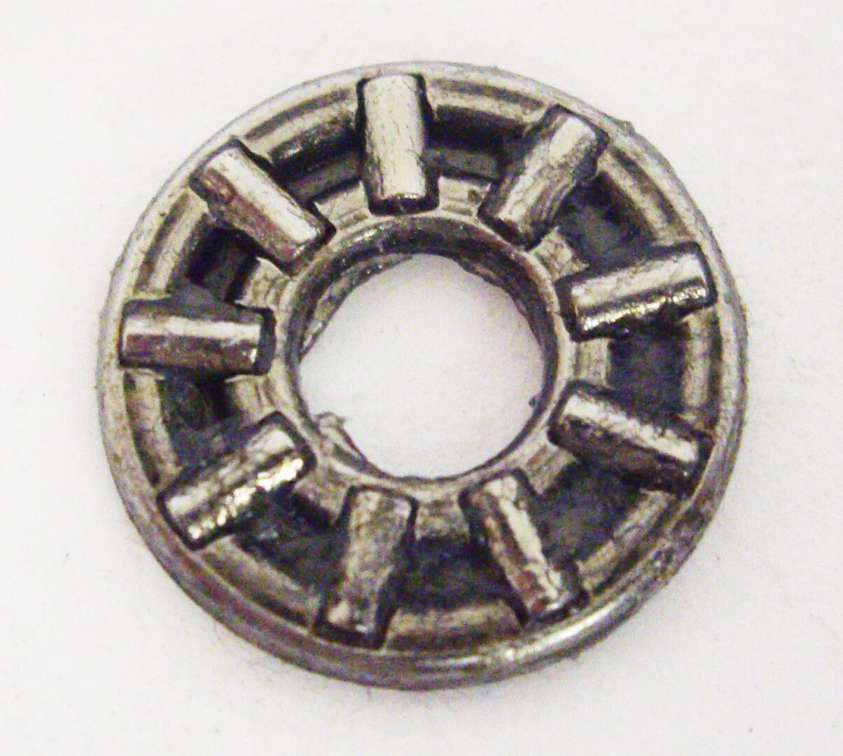 A metal object with a ring around it.