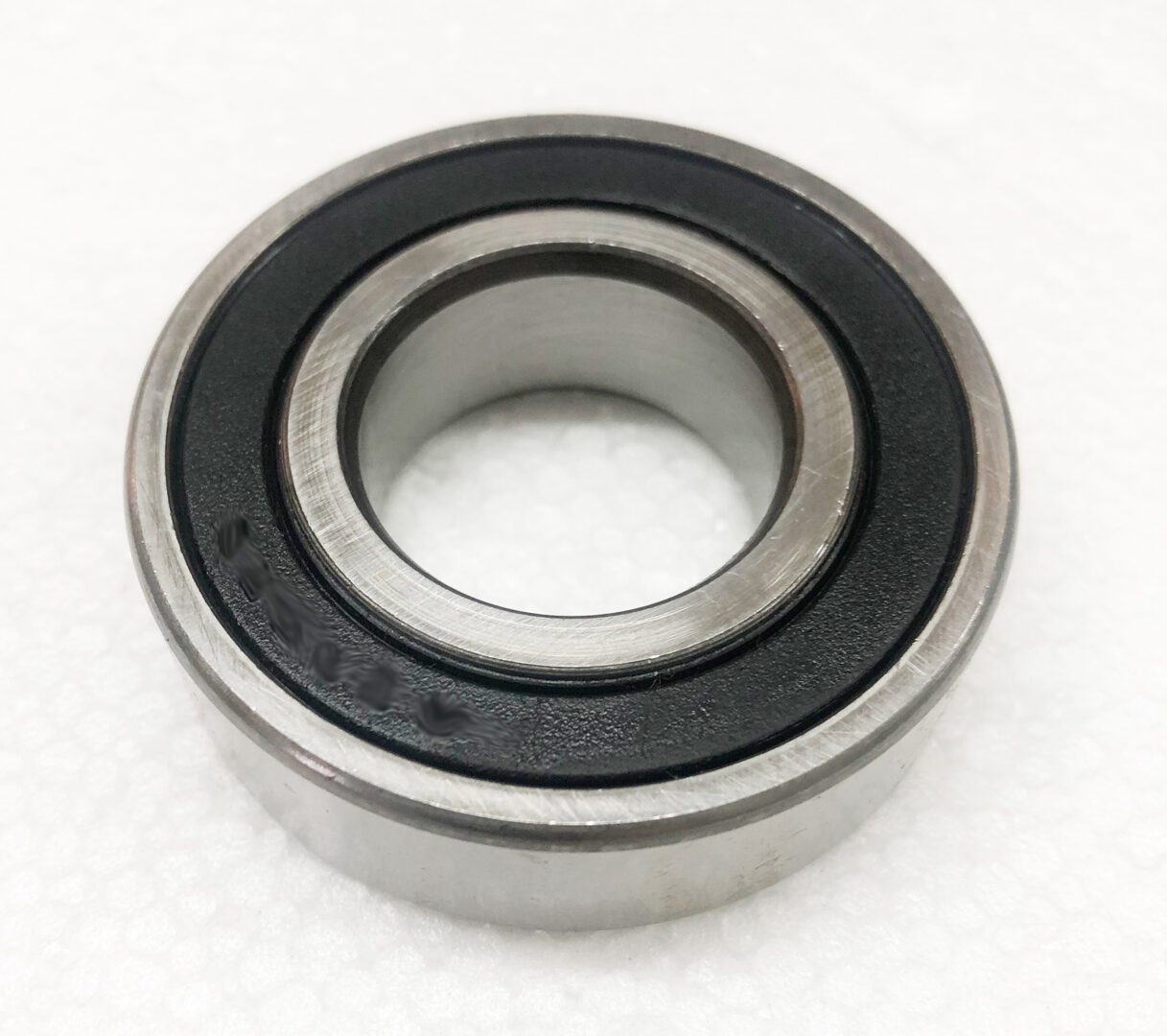 A ball bearing is shown on the floor.