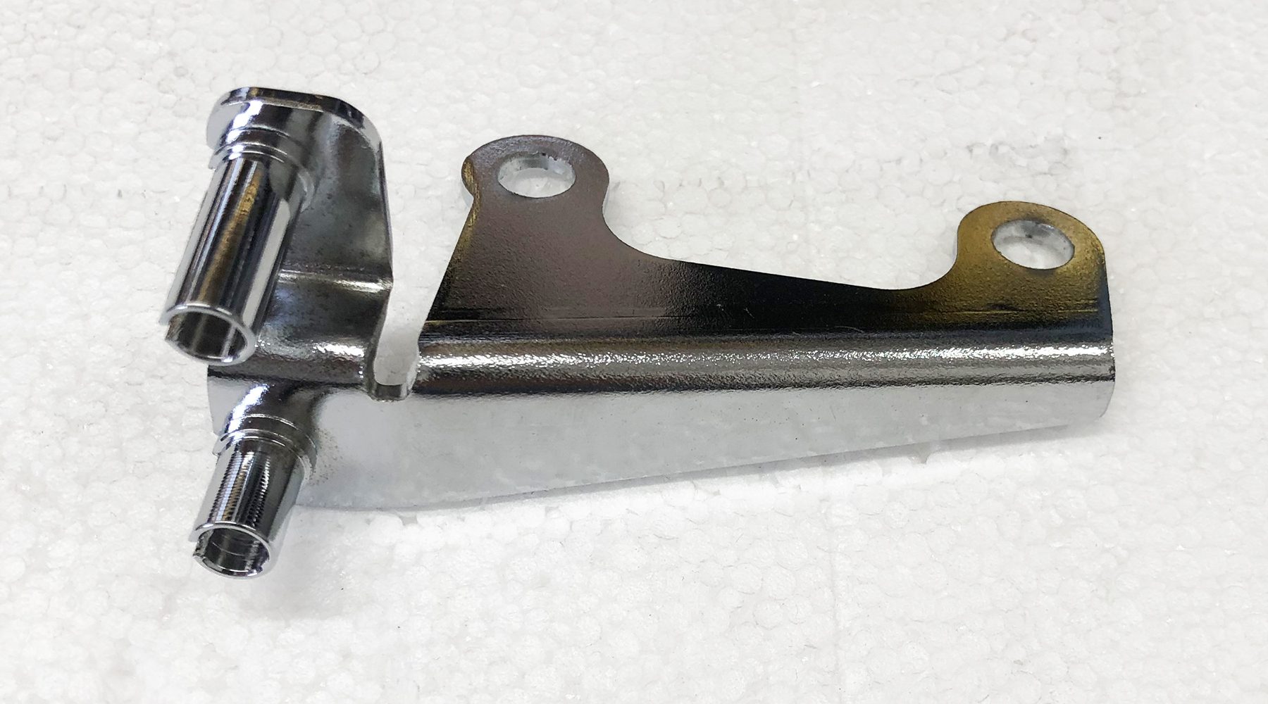 A metal piece of equipment sitting on top of a table.