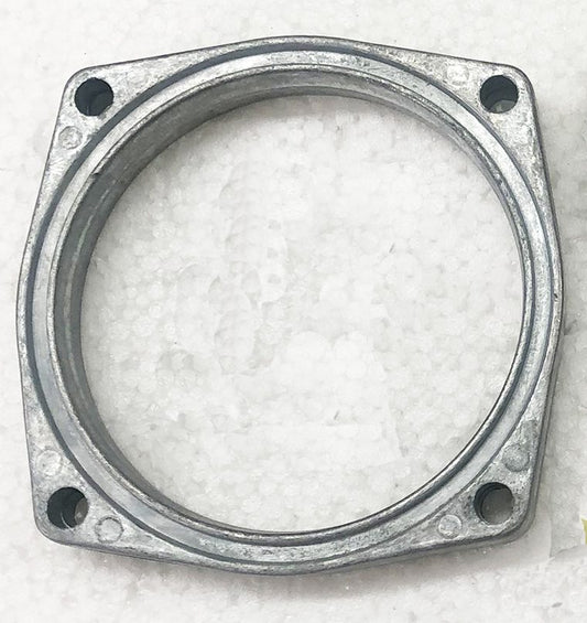 A metal ring with four holes on it.