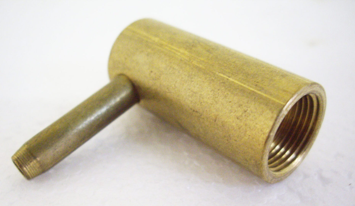 A close up of the end of a brass pipe