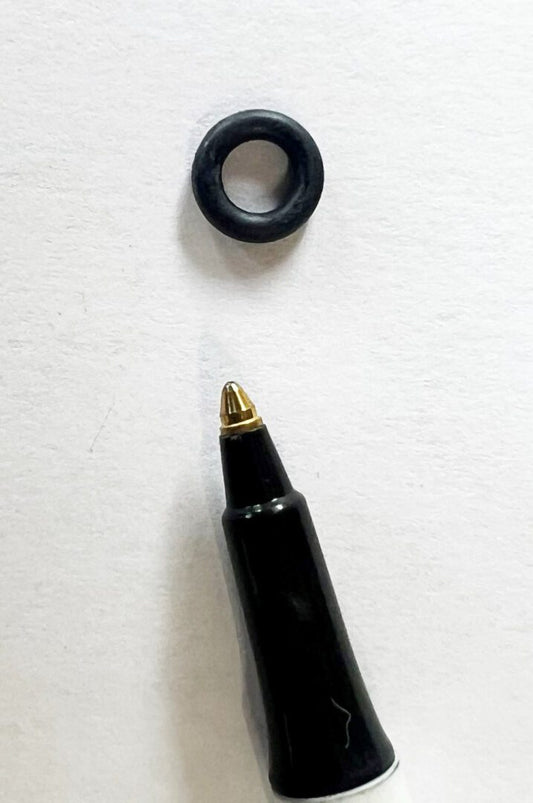 A black pen and some black rubber rings