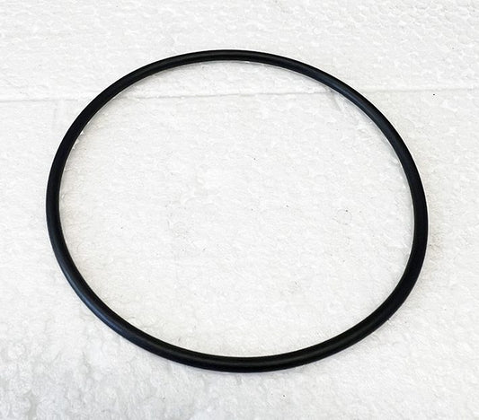 A black rubber ring on top of white paper.