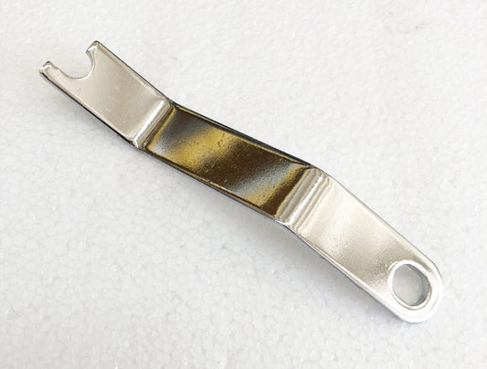 A metal object with a brown strip on it.