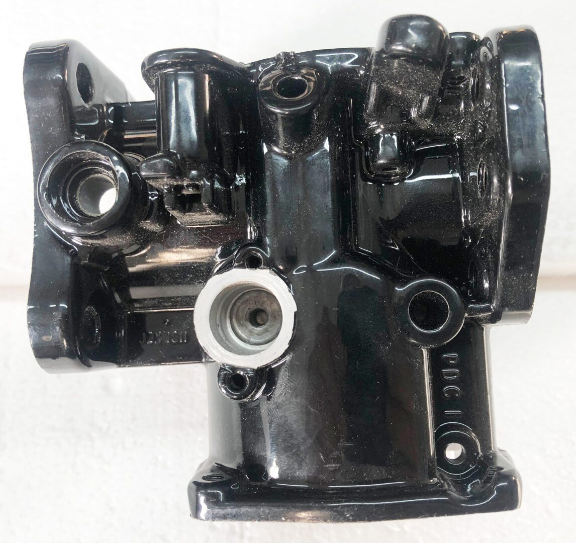 A black and white photo of an engine block.