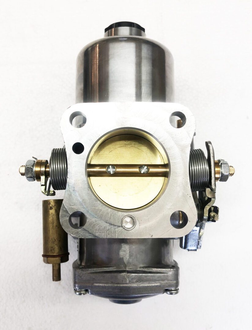 A close up of the throttle body on a car