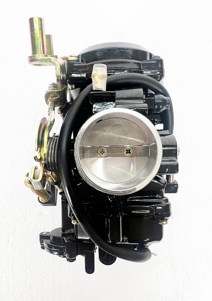 A close up of the throttle body on a car