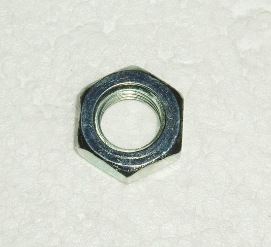 A close up of an hex nut on top of white paper