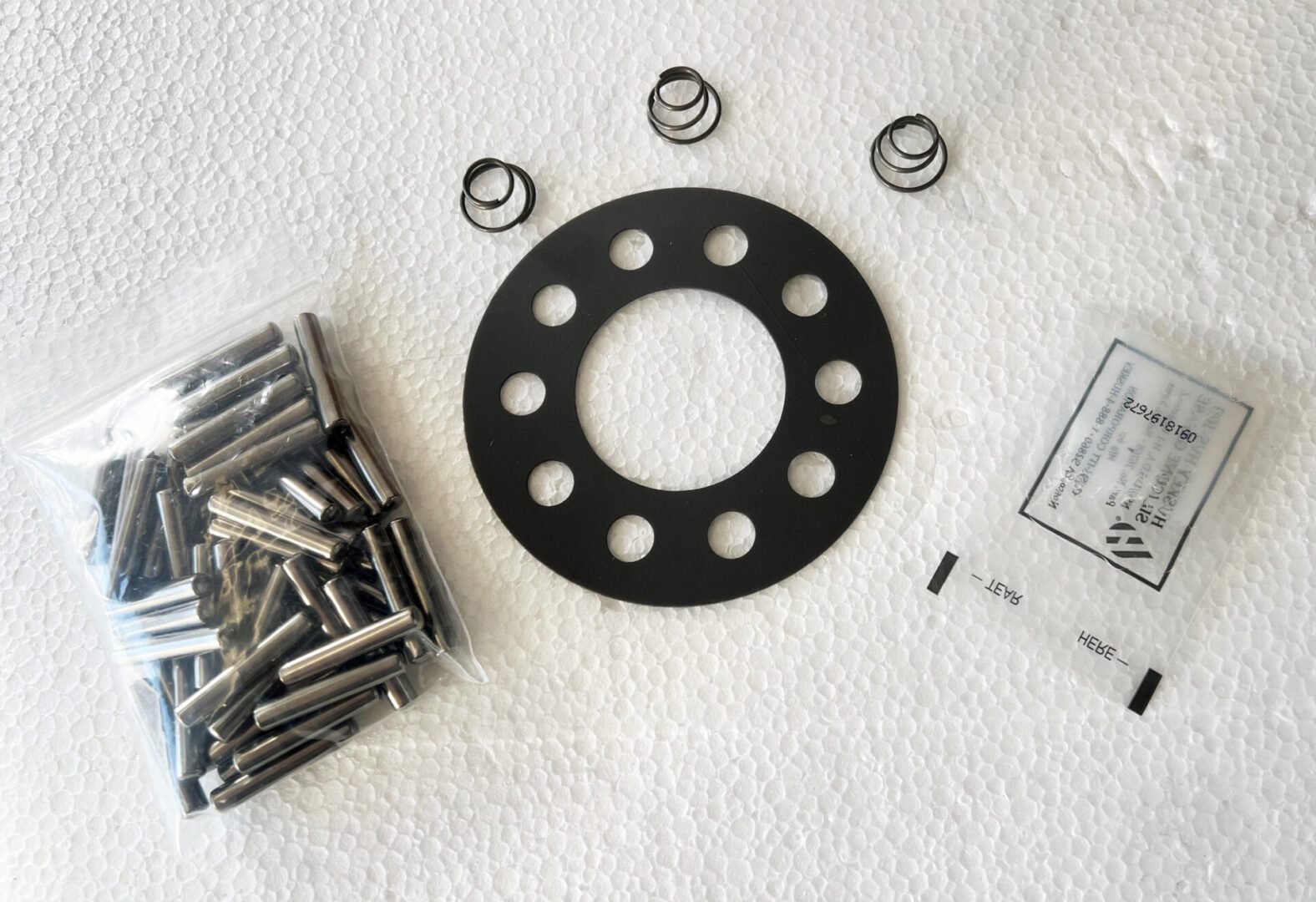 A picture of some parts that are needed to make a homemade clock.