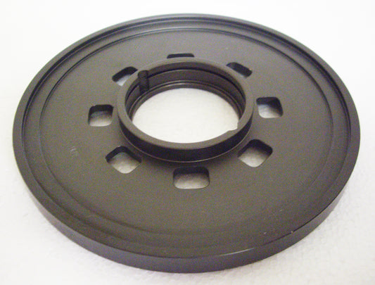 A black plastic disc with a hole in the center.