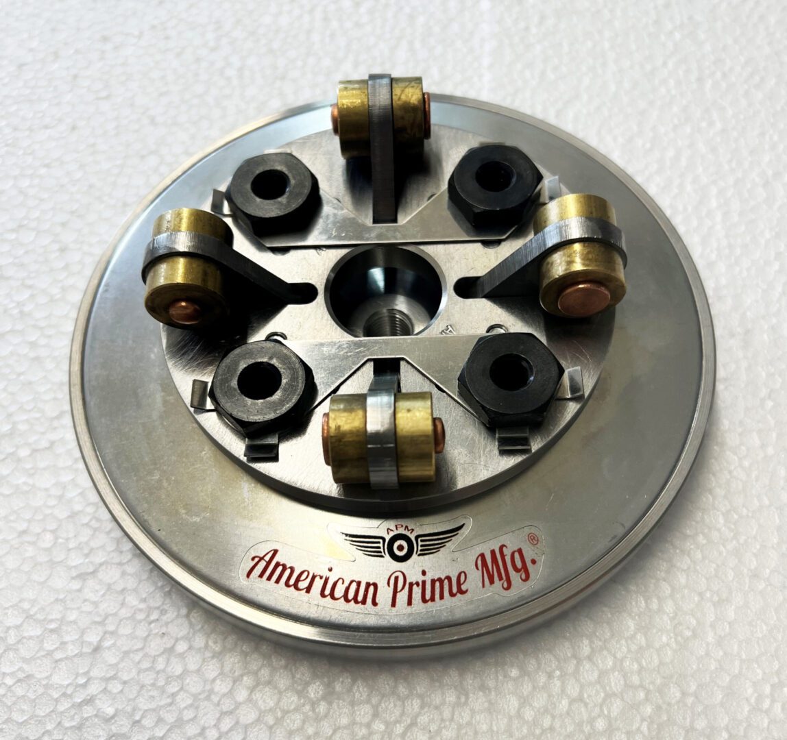 A metal disc with six different sized nuts.