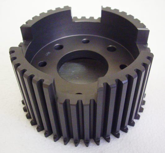 A black metal gear with holes in it.