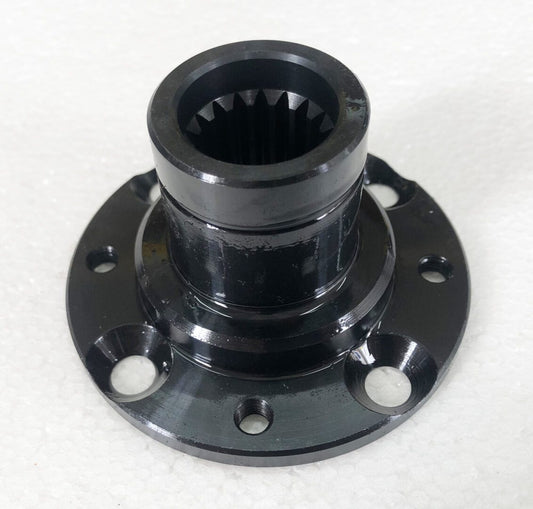 A black metal object with four holes on top of it.