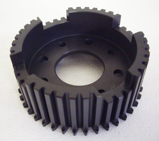 A black plastic gear with a hole in it.