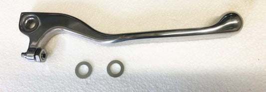 A metal handle and some washers on top of a white surface.
