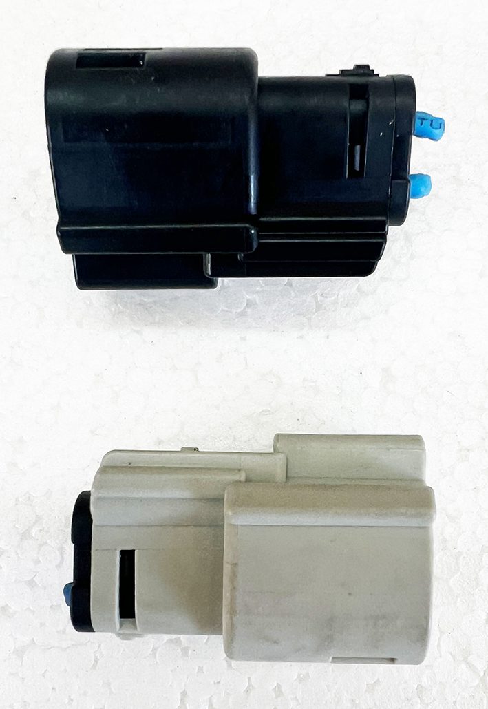 Two different types of ink cartridges on a table.