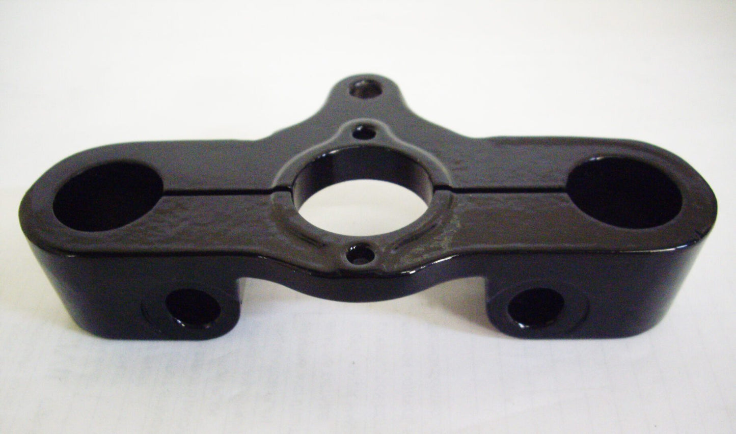 A black plastic piece of equipment sitting on top of a table.