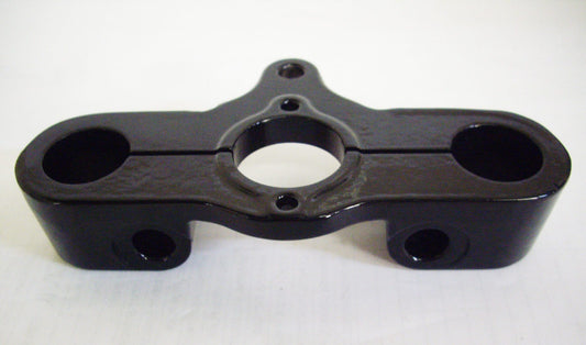 A black plastic piece of equipment sitting on top of a table.