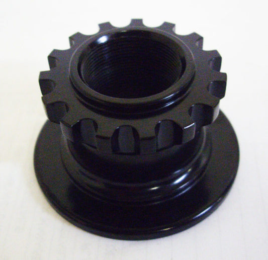 A black plastic object with a large gear on top of it.