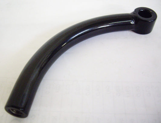 A black handle on top of a white table.