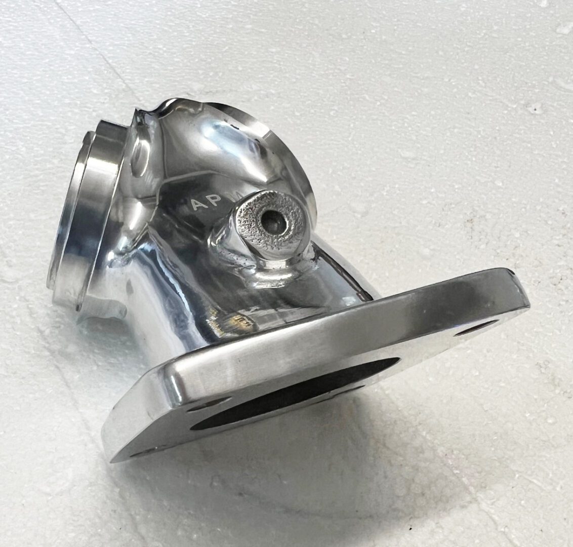 A metal object sitting on top of a table.