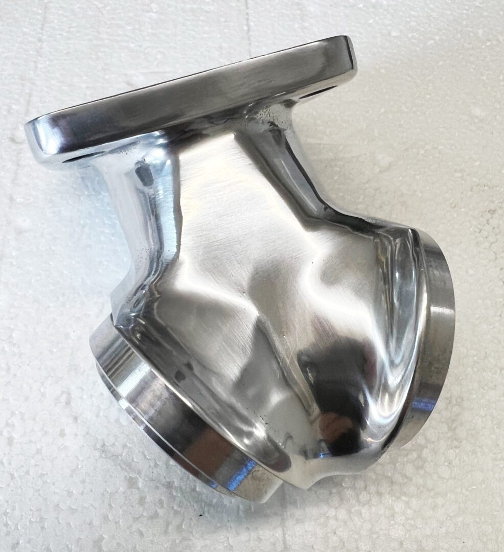 A close up of the bottom part of a metal object.