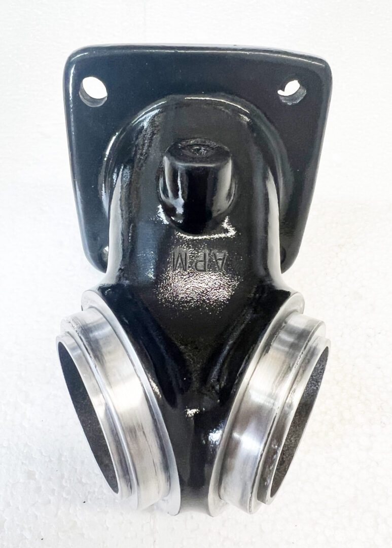 A black and silver wall mounted holder with two metal rings.