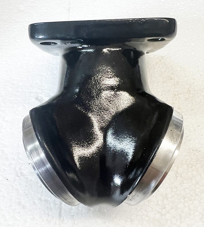 A black and silver metal object sitting on top of a table.