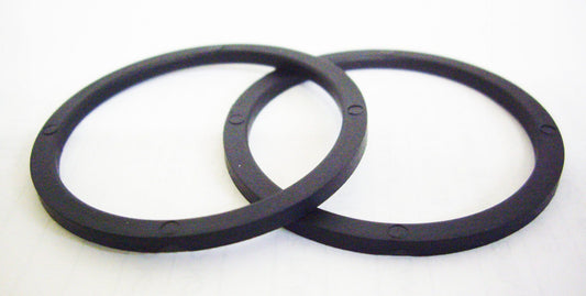 A pair of black rubber rings sitting on top of each other.
