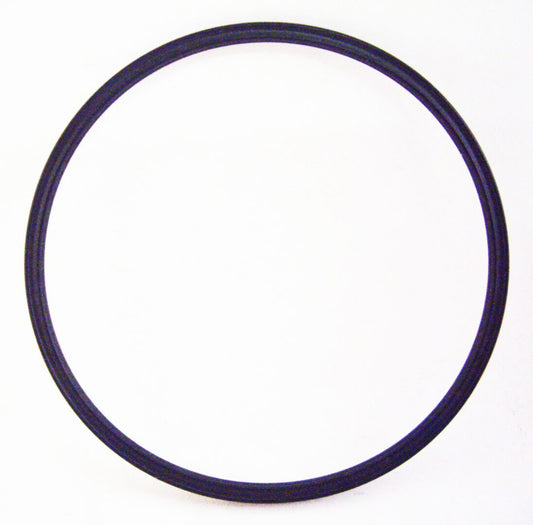 A black rubber ring is sitting on the floor.