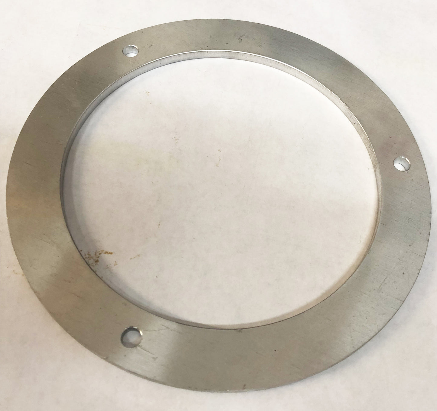 A metal ring with holes for the top of it.