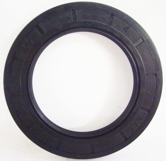 A black rubber seal ring on top of a white wall.
